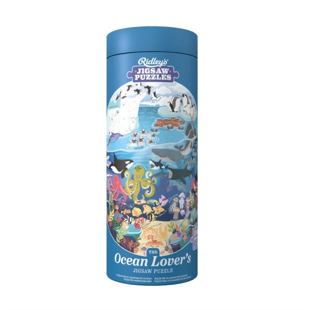 Blue tube containing 1000 piece jigsaw featuring sea creatures and plants
