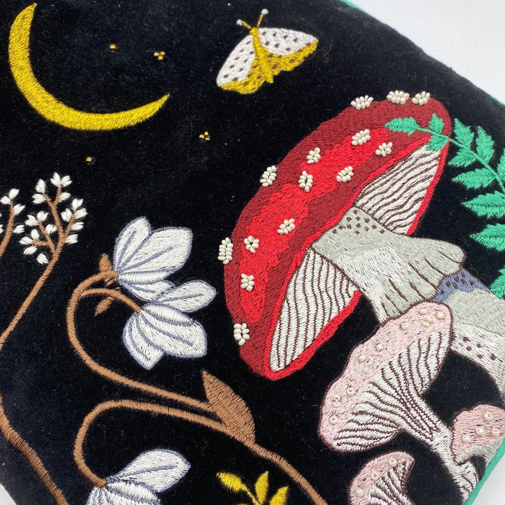 Detail of woodland embroidery on hot water bottle cover