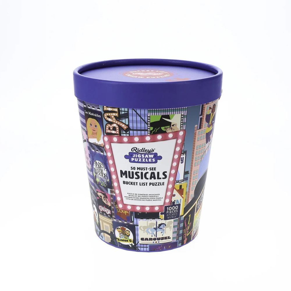 A tub containing a 1000 piece jigsaw puzzle with images of must see musicals