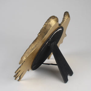 Side view of Decorative photo framet with gold and black design on a white background