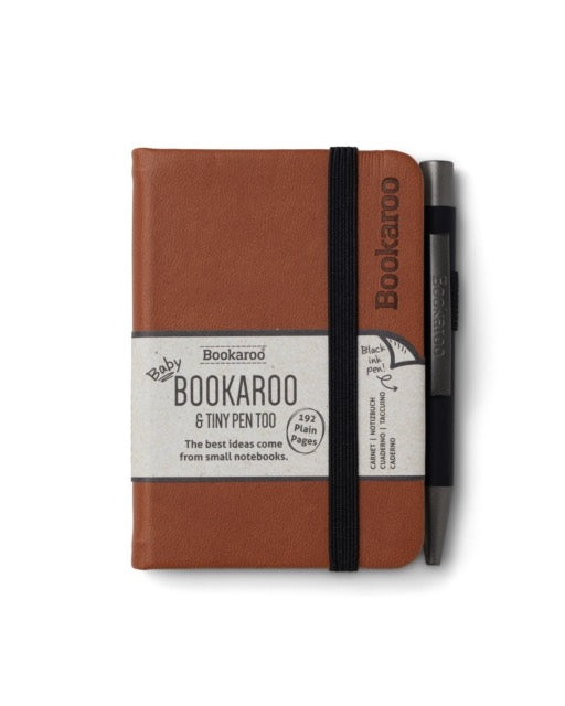 Little notebook in brown with black elastic fastening and black pen