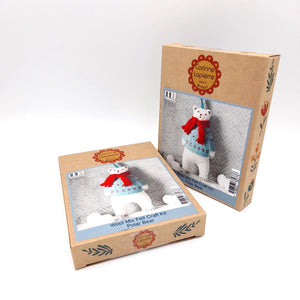 Two cardboard boxes with images of a polar bear craft kit on a white background