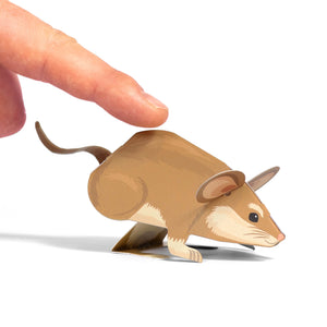 Wooden mouse toy with a hand touching it on a white background