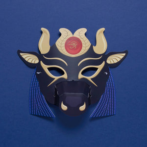 Decorative mask with horns and a red eye symbol on a blue background