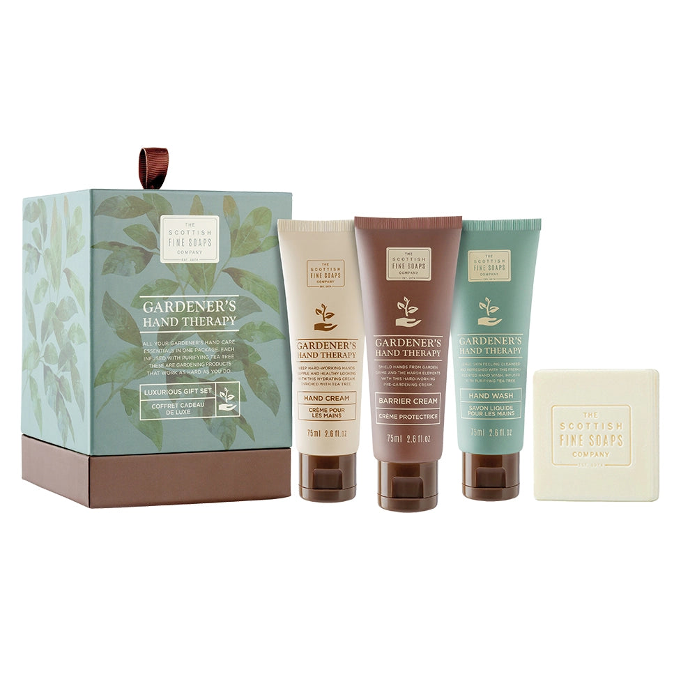 Gardener's Hand Therapy product set including a box, three tubes, and a bar of soap on a white background.