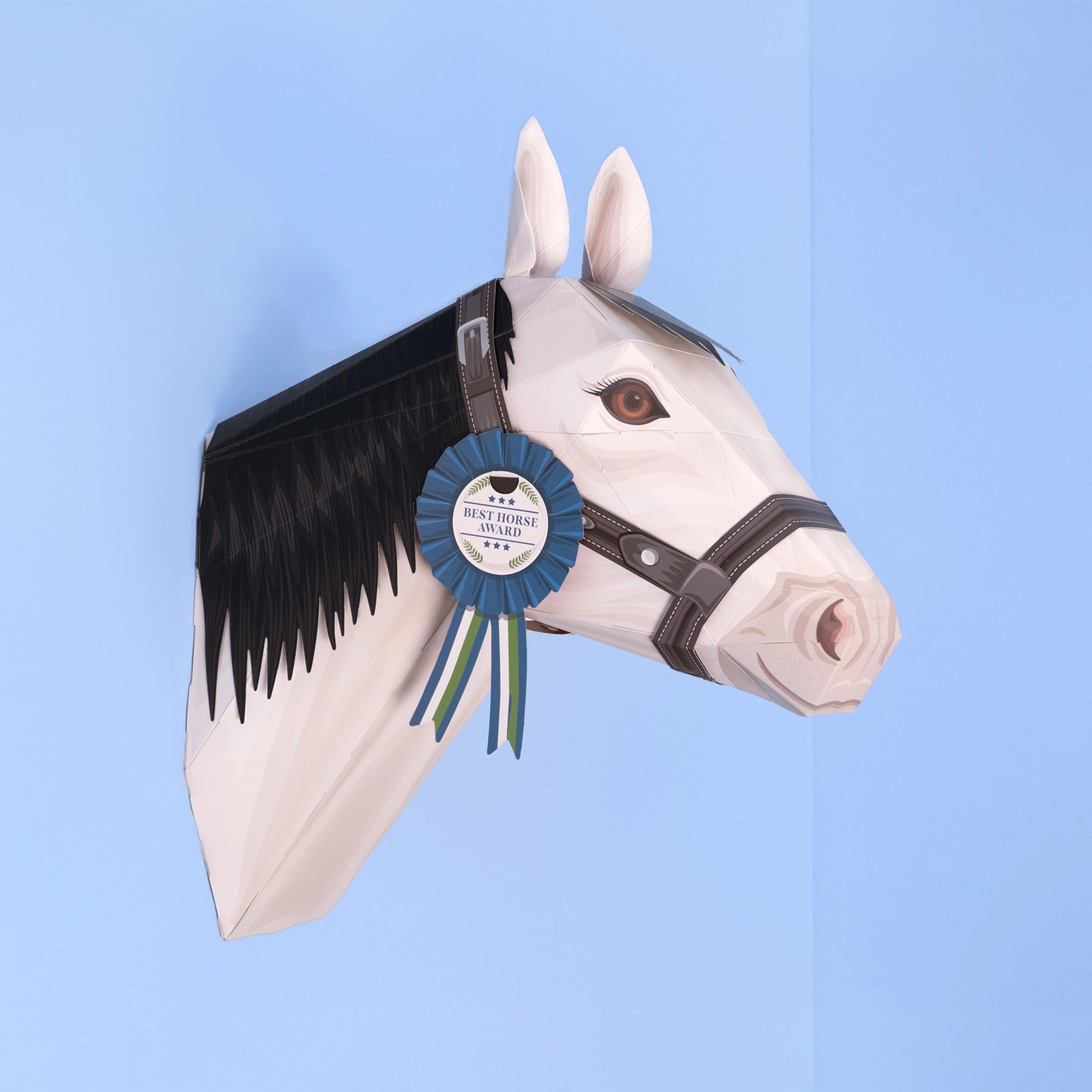 Horse head sculpture with a blue ribbon on a light blue background