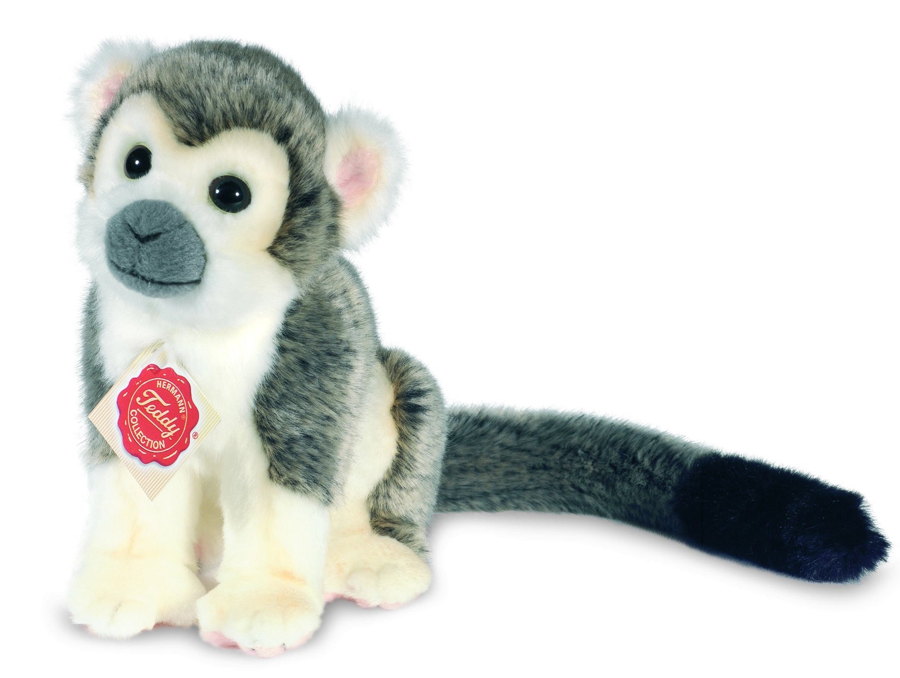 Plush monkey toy with a visible tag on a white background