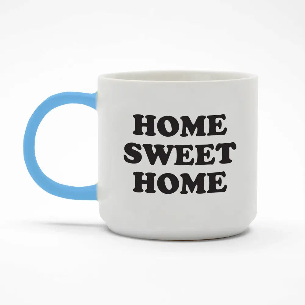 White mug with blue handle and 'HOME SWEET HOME' text on a white background