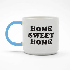 White mug with blue handle and 'HOME SWEET HOME' text on a white background