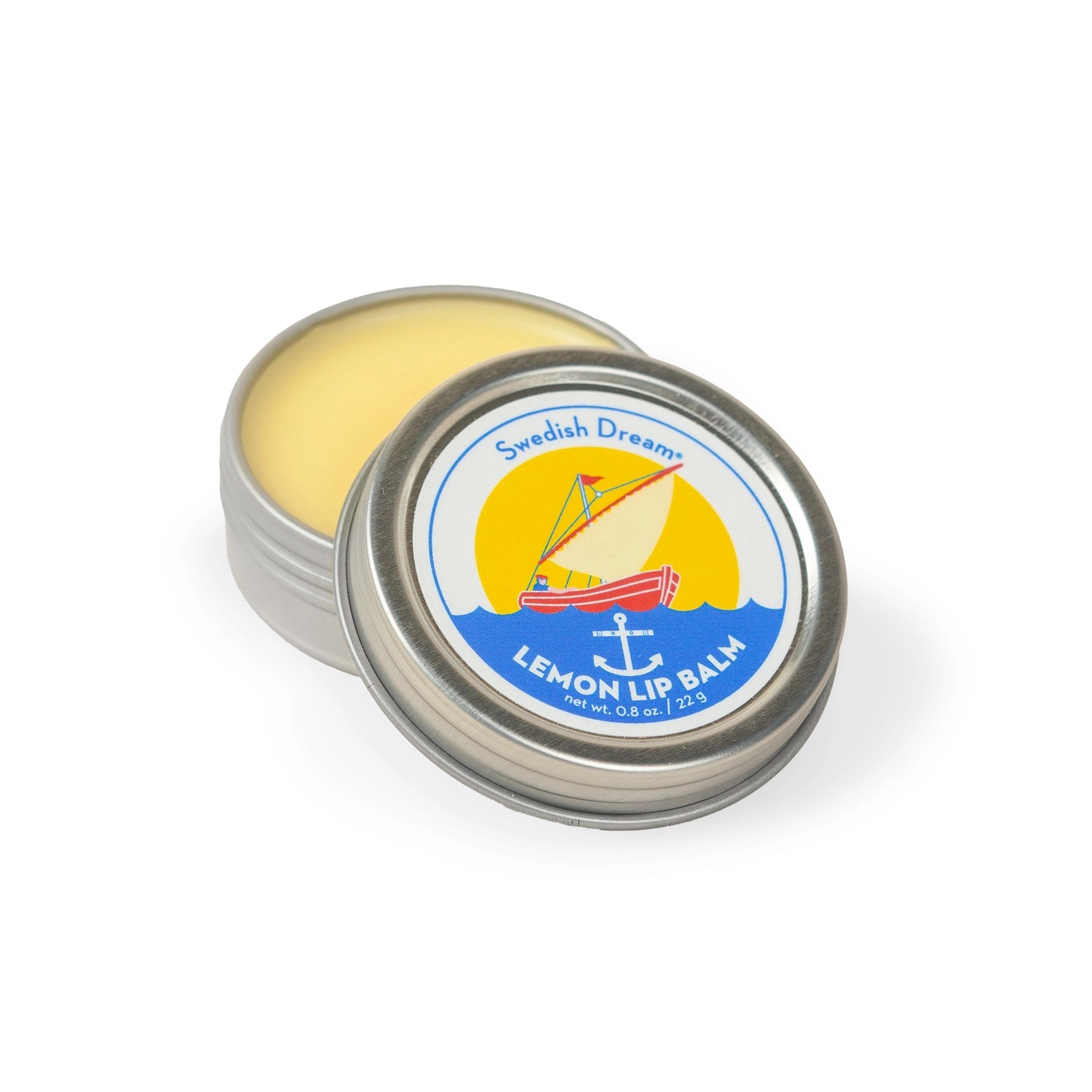 Lemon lip balm in a tin with a colorful label on a white background