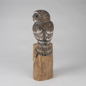 Wooden owl Sculpture on a gray background