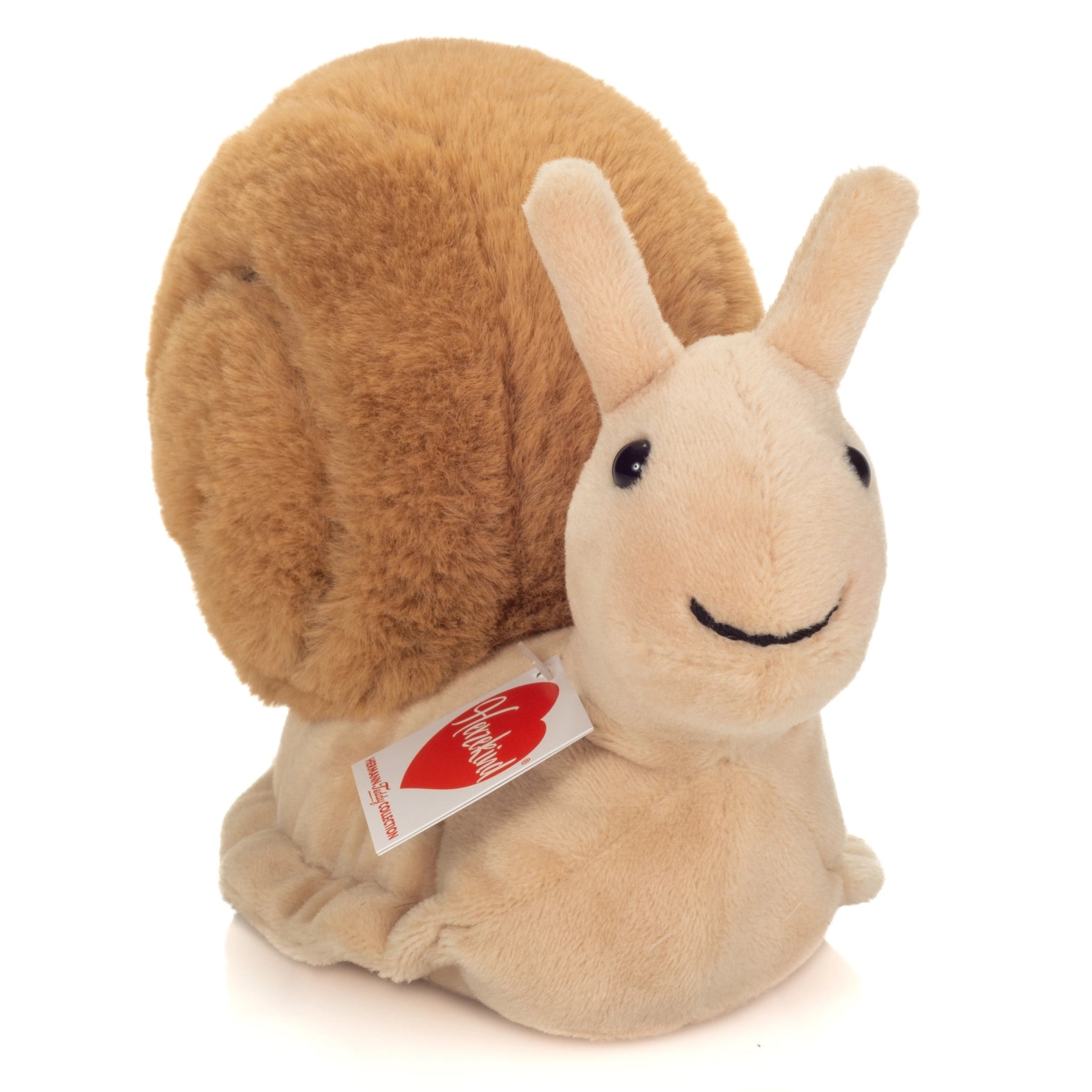 Plush snail toy with a visible tag on a white background