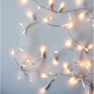 String of small lights on a white background