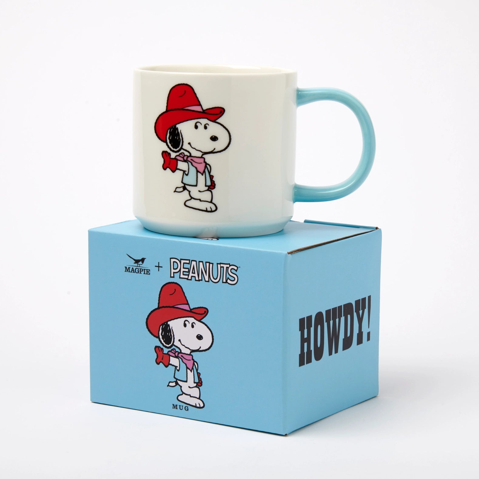 Mug with cartoon character on a blue box labeled 'Peanuts' and 'Howdy!'
