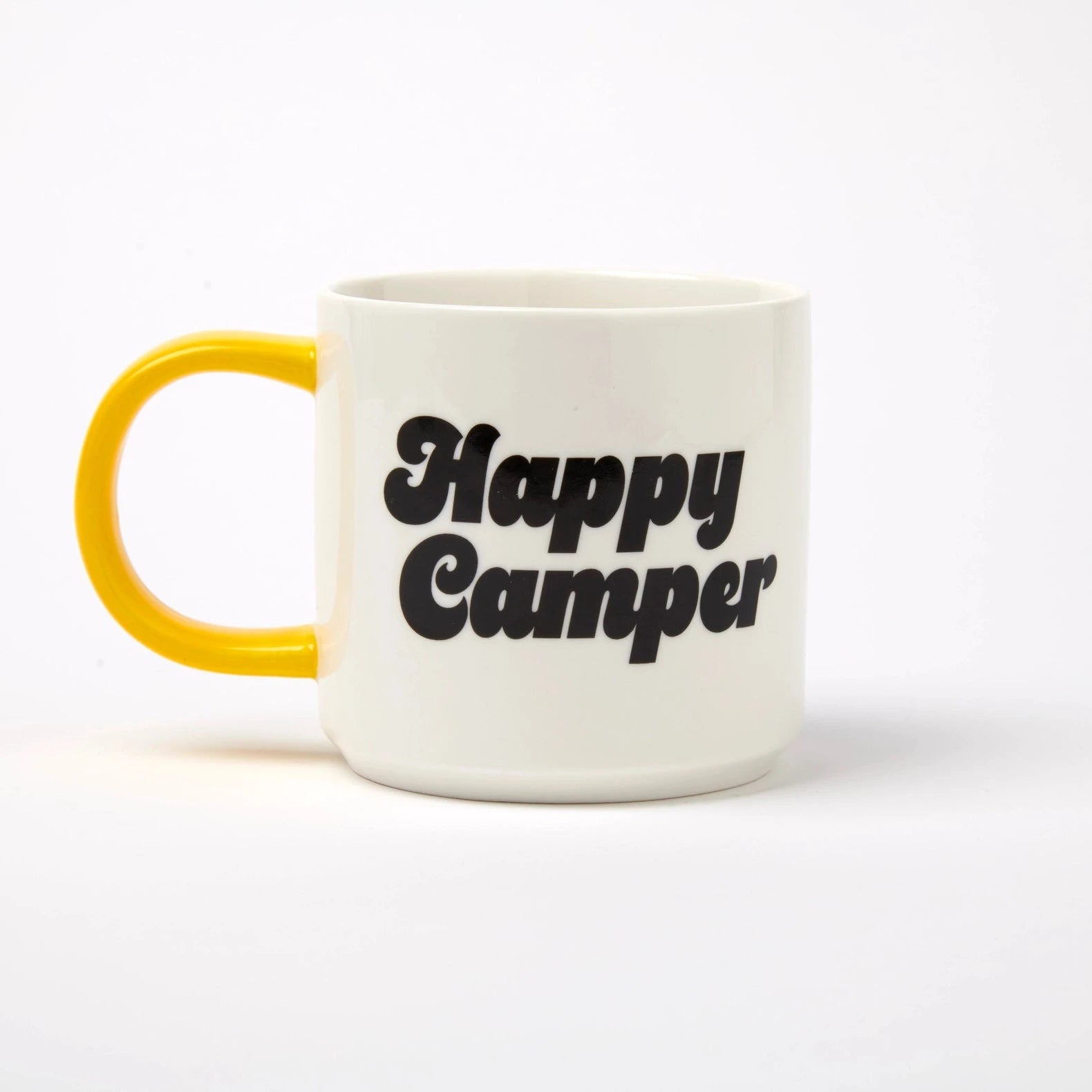 Mug with 'Happy Camper' text and yellow handle on a white background