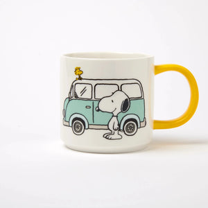 Mug with a cartoon design of a dog and car on a white background