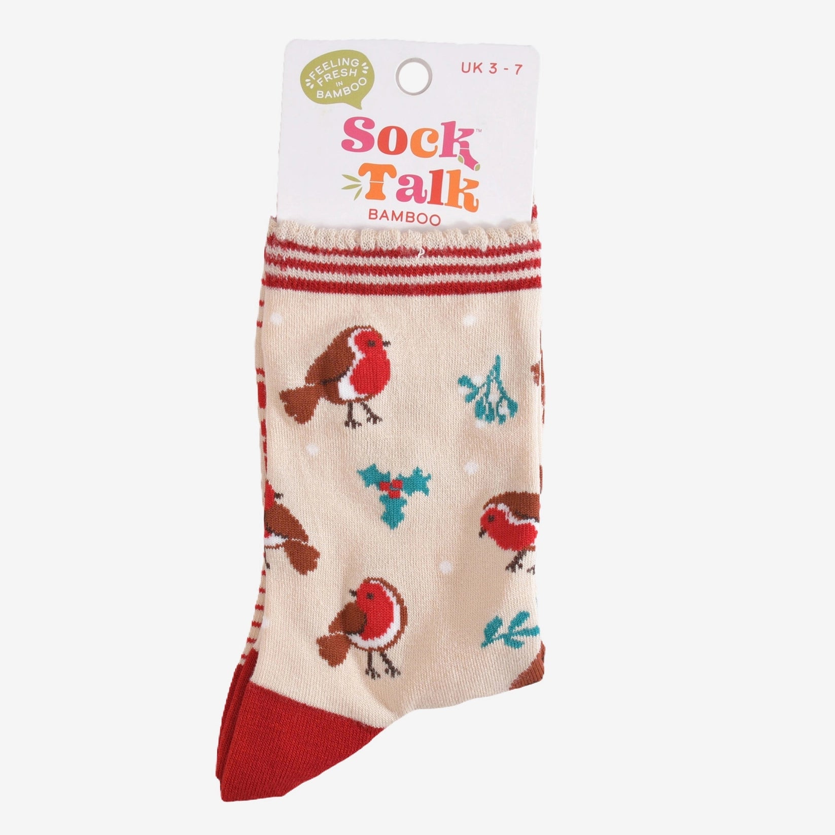 A pair of cream women's socks decorated with Red Robins and white spots