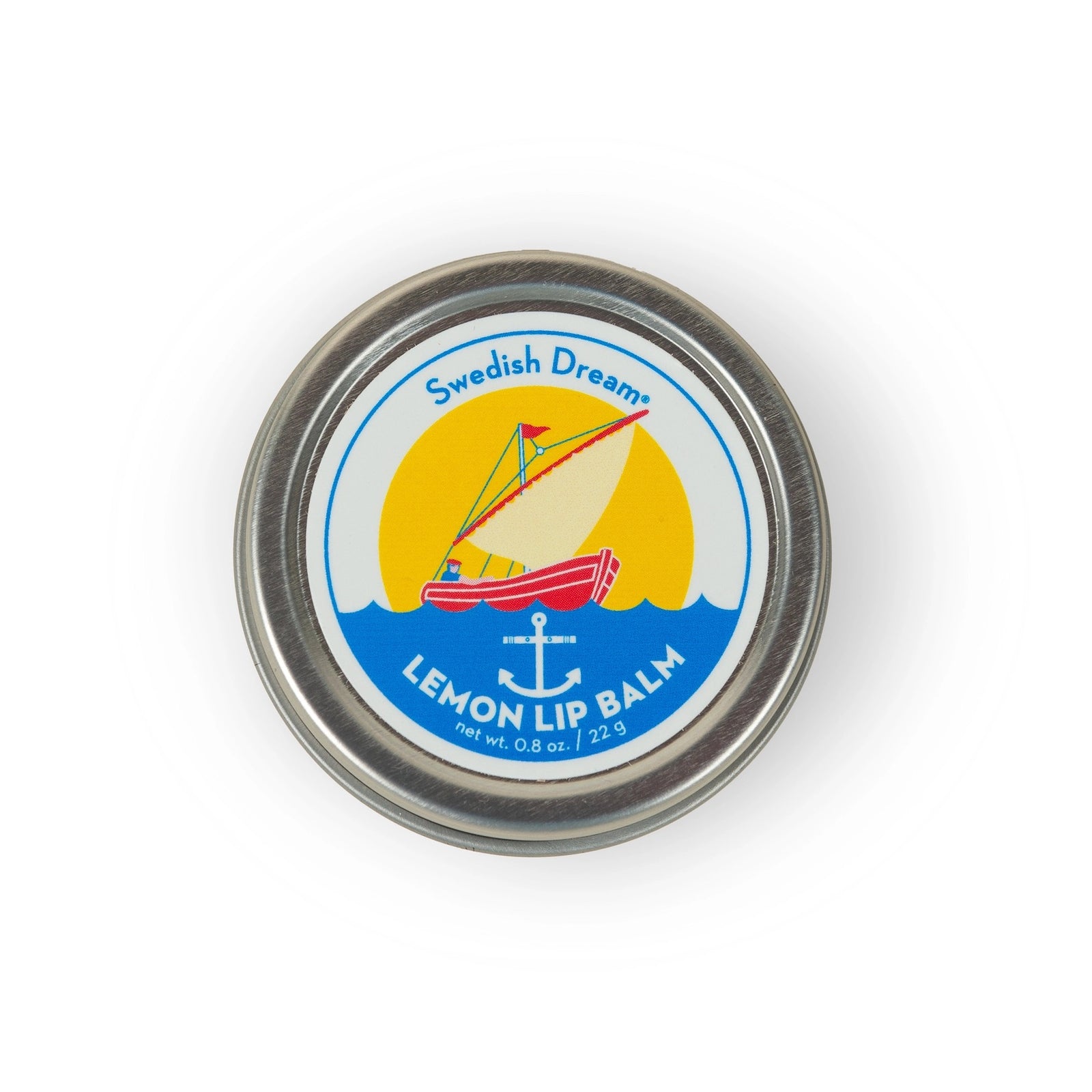 Round metal tin with lemon lip balm