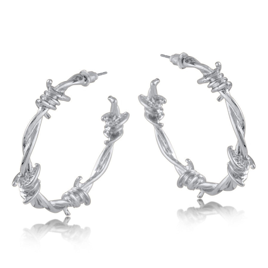 Silver hoop earrings with barbed wire design on a white background