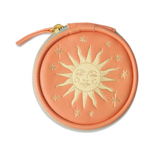 Round pink pouch with sun design on a white background