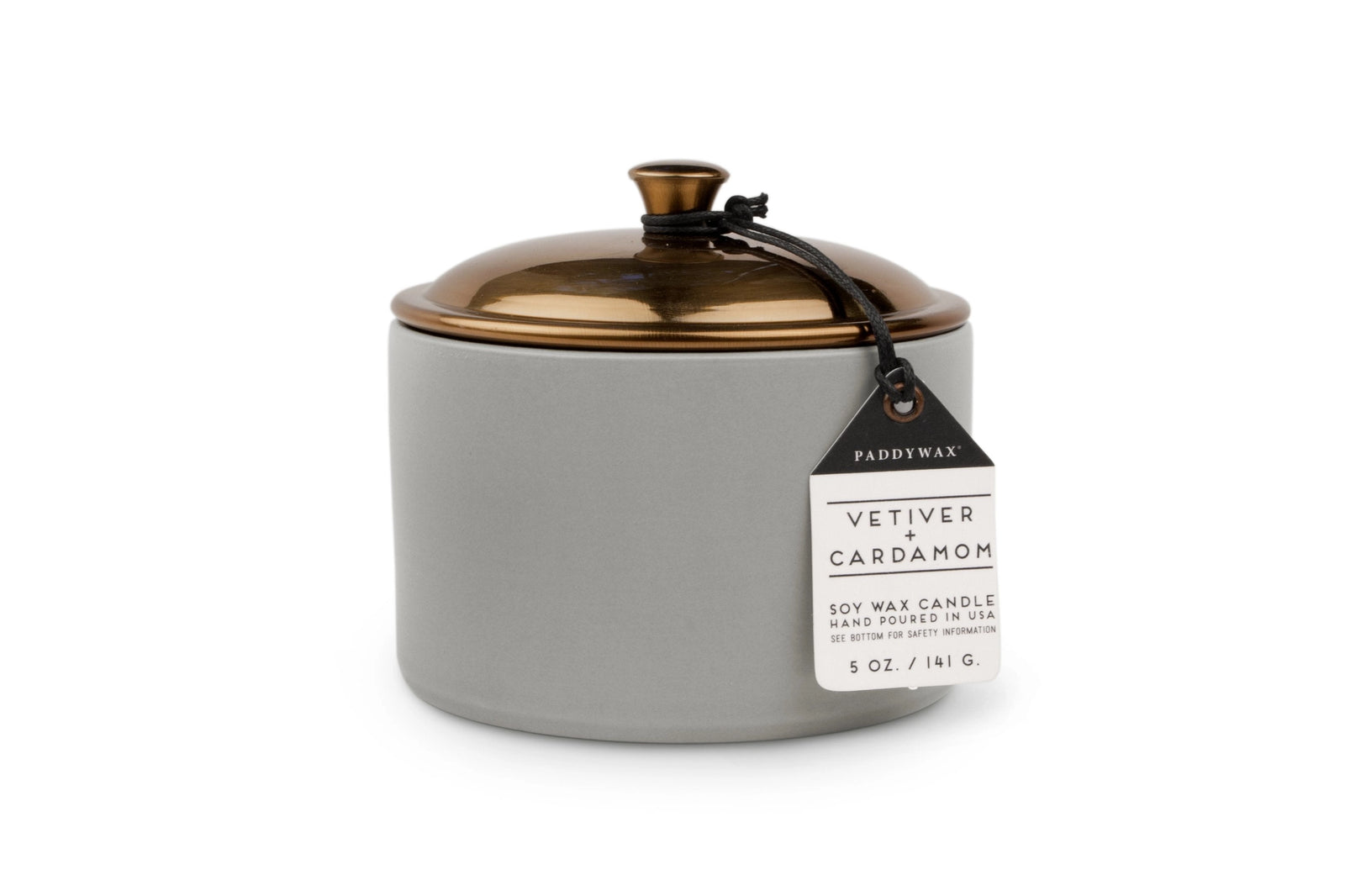 Gray candle jar with gold lid and 'Paddywax' label on a white background
