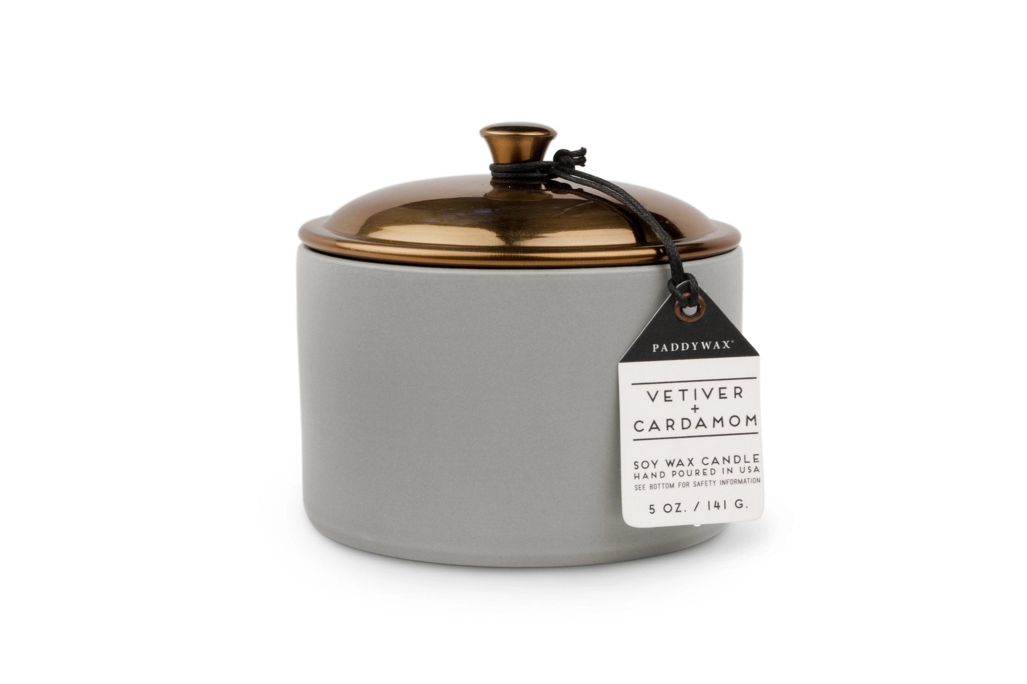 Gray candle jar with gold lid and 'Paddywax' label on a white background
