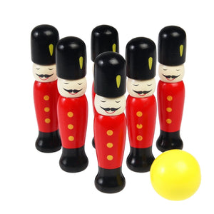 Set of toy soldiers in red uniforms with black hats and a yellow ball on a white background